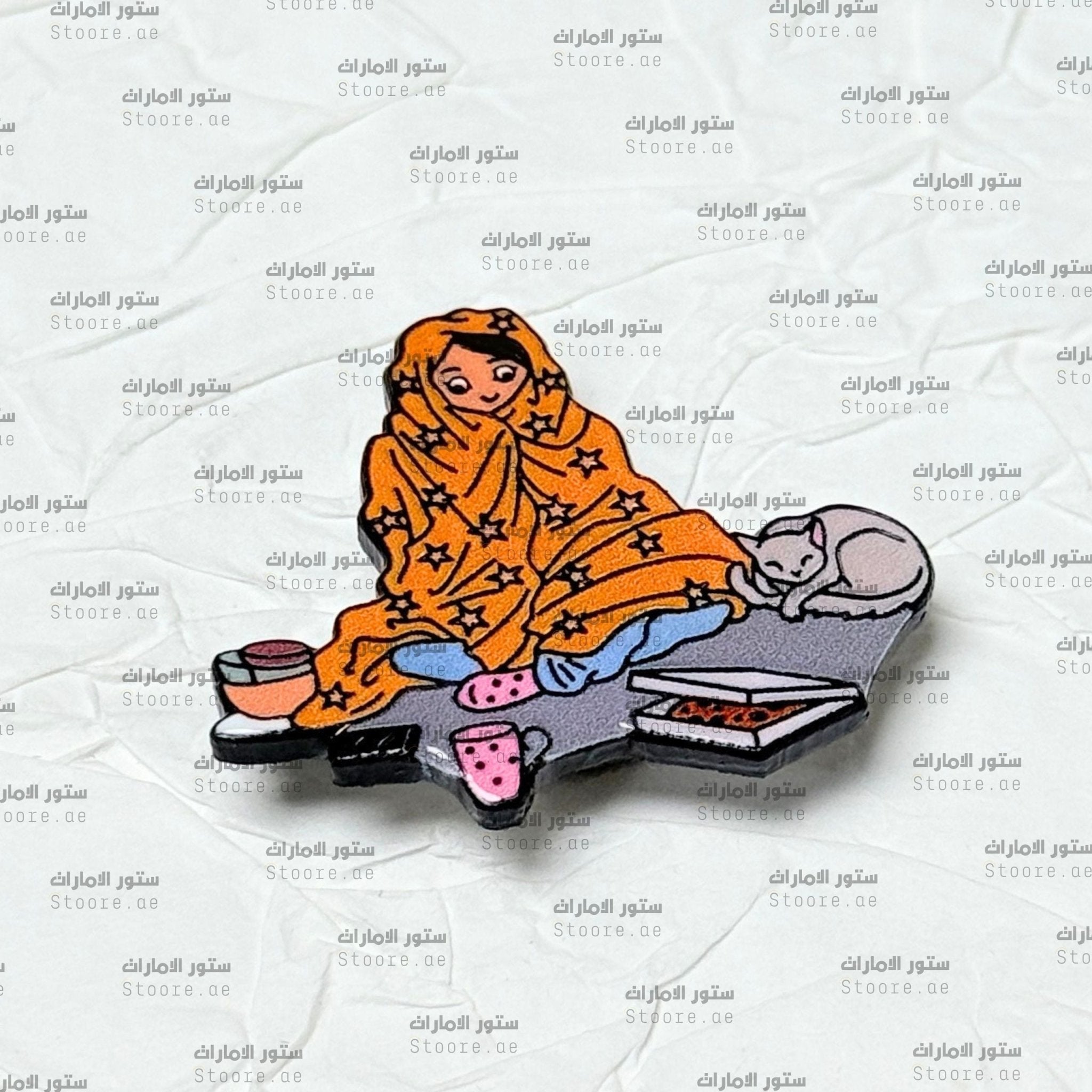 Badge Person Wrapped in a Blanket With a Cat