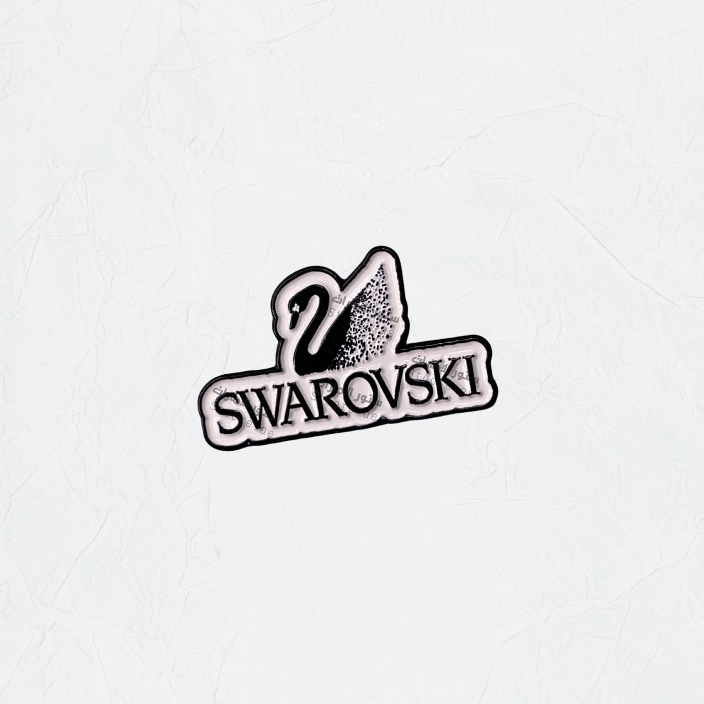 Badge SWAROVSKI - STOORE.AE | ستور الامارات