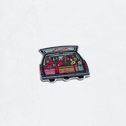 Badge Flowers in Car Trunk