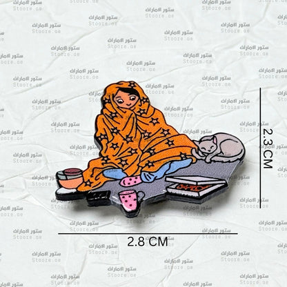 Badge Person Wrapped in a Blanket With a Cat